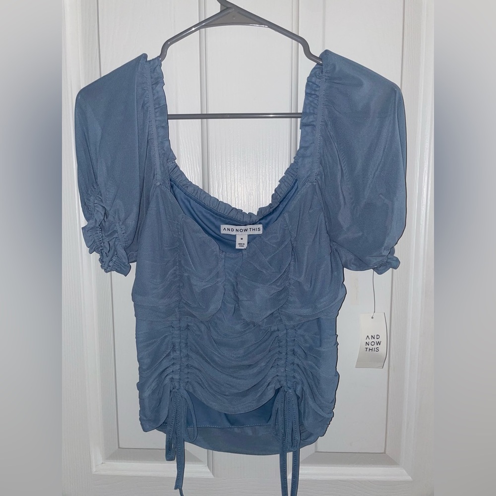 Blue top with cinched sides